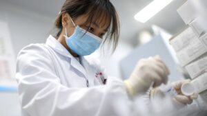 A laboratory technician conducts an artificial intelligence (AI)-based cervical cancer screening at a test facility in Wuhan, China. 2023.