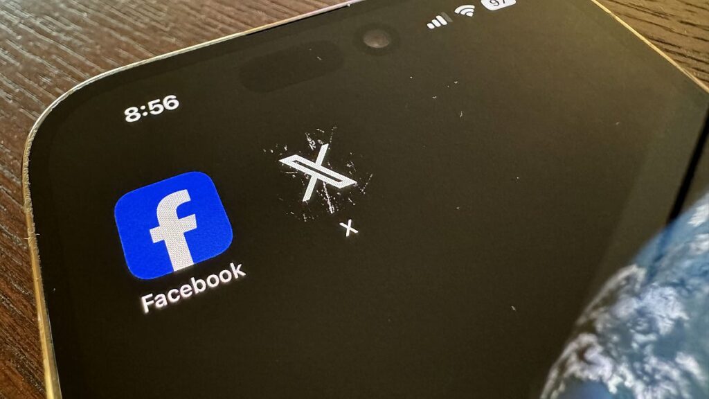 App logos for Facebook, left, and X, formerly known as Twitter, are seen on a mobile phone in Los Angeles, Saturday, March 16, 2024.