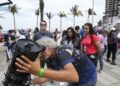 An amateur astronomer prepares her telescope a day before a total solar eclipse in Mazatlan, Mexico, Sunday, April 7, 2024.