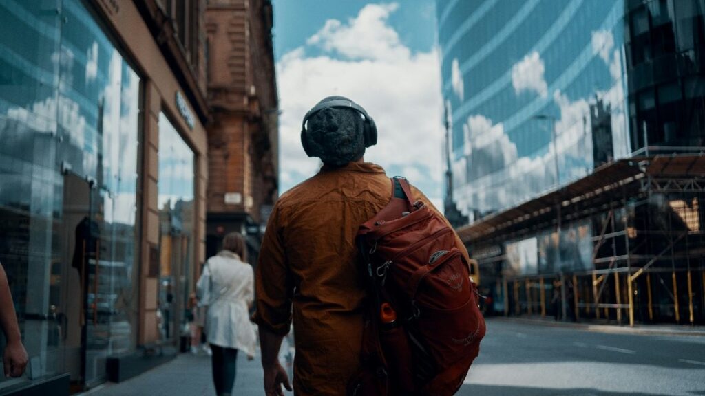 Is a change coming? A commuter moves through Glasgow on foot