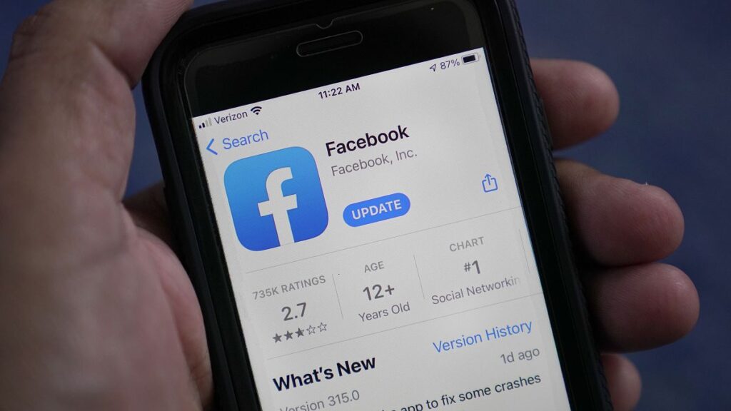 FILE - The Facebook app is shown on a smartphone.