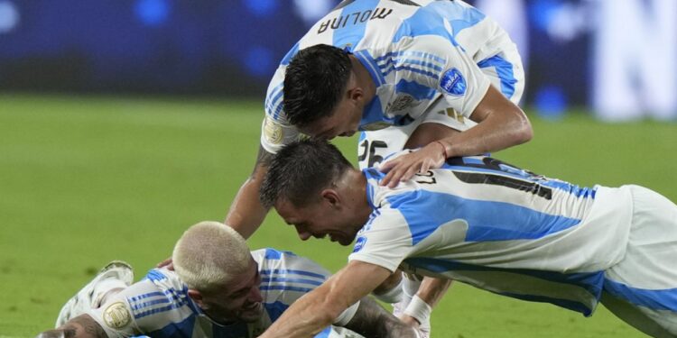 Argentina players celebrate after defeating Colombia in the final of the Copa America football tournament in Miami Gardens, Florida, Monday, July 15, 2024.