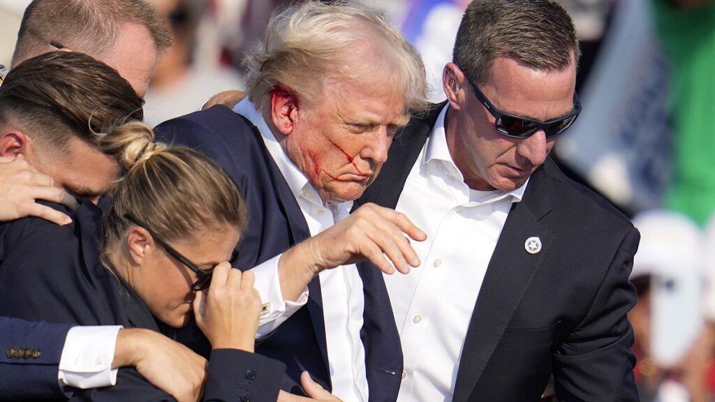 Republican presidential candidate former President Donald Trump is helped off the stage at a campaign event in Butler, Pa., on Saturday, July 13, 2024.