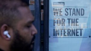 A pedestrian walks past a sign outside of a Mozilla office in San Francisco, Wednesday, April 12, 2023.