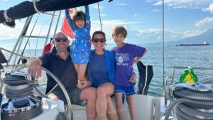 Larissa, Duncan, Skye and Eden hang out on their sailboat, Freeranger