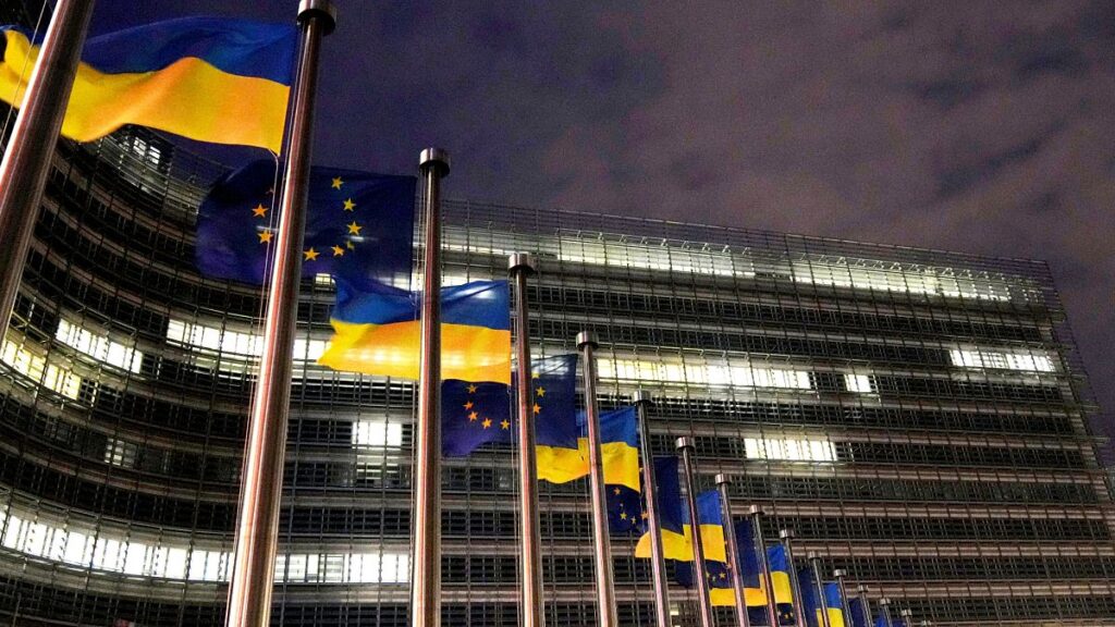 The European Union and Ukrainian flags outside the EU headquarters in Brussels, 24 February, 2025