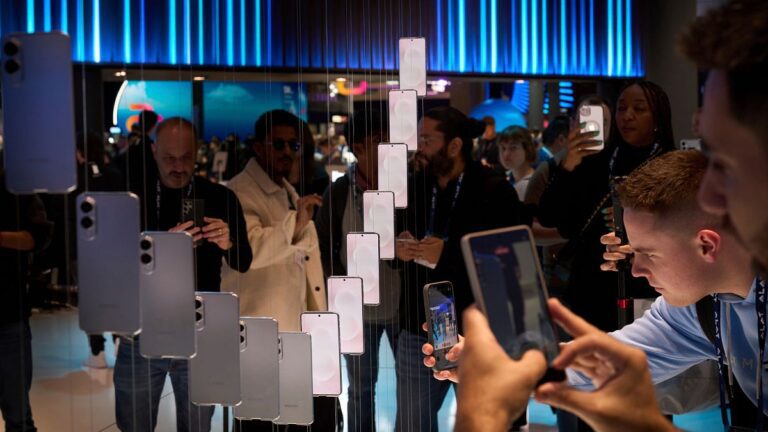 Visitors take pictures of the newly introduced phone the Galaxy S25 Edge, during the Mobile World Congress in Barcelona, Spain, Monday, March 3, 2025