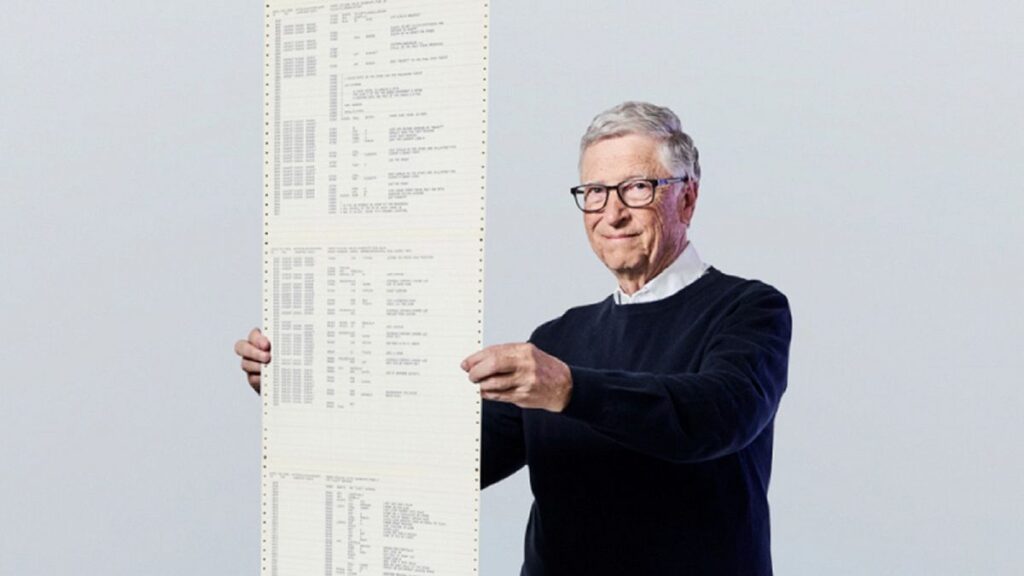 This recent photo provided by Gates Ventures shows Microsoft founder Bill Gates holding a printout of the computer coding that launched the software maker in April 1975.