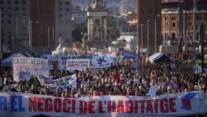 People gather during a demonstration to protest high housing costs in Barcelona, Spain, Saturday, April 5, 2025.
